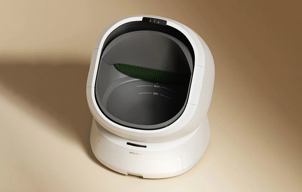 White automatic cat litter box shown from the front on a light background