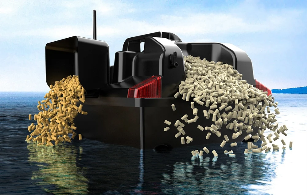 Black bait boat massively dumping two kinds of yellow and white pellets into calm water