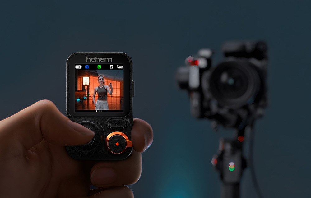 Remote control with live view, gimbal with attached camera in the background