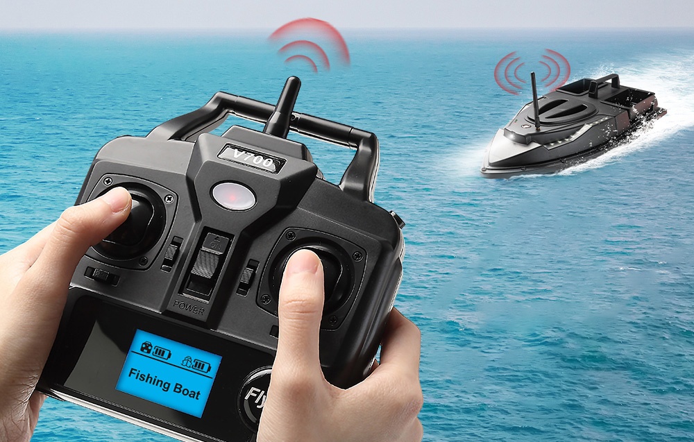Hands holding an RC remote control with a “Fishing Boat” display, controlling the bait boat on a lake with red waves
