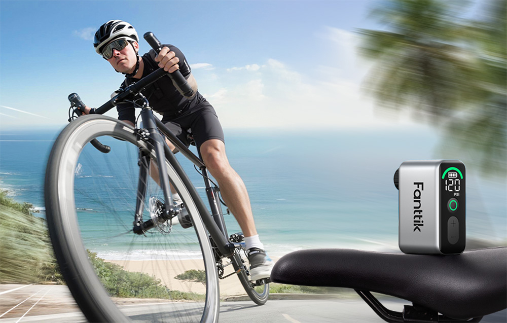 Fanttik mini bike pump on a saddle with a boy riding a bike in the background