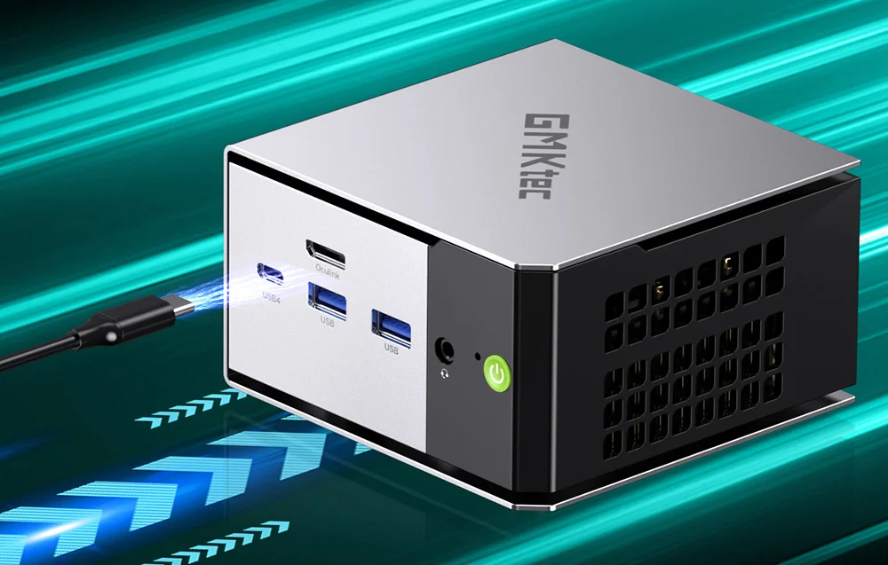 Close-up view of the front panel of the GMKtec mini PC, with a cable connected to the USB4 port and a visible green power button.