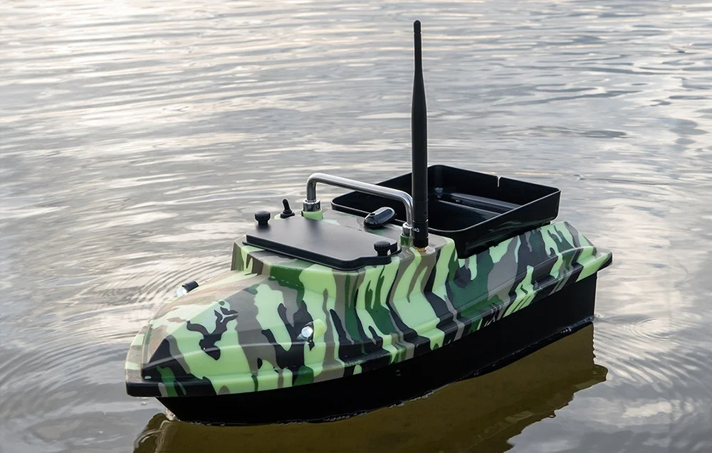 Moro bait boat with antenna and waterers on calm water, side view of full details