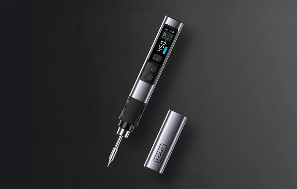 Silver FNIRSI soldering iron with protective tip case.