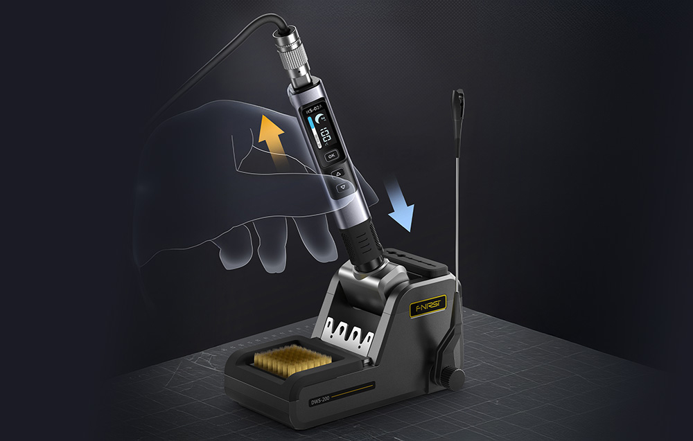 The FNIRSI soldering iron placed in a docking station with a tip-cleaning sponge.