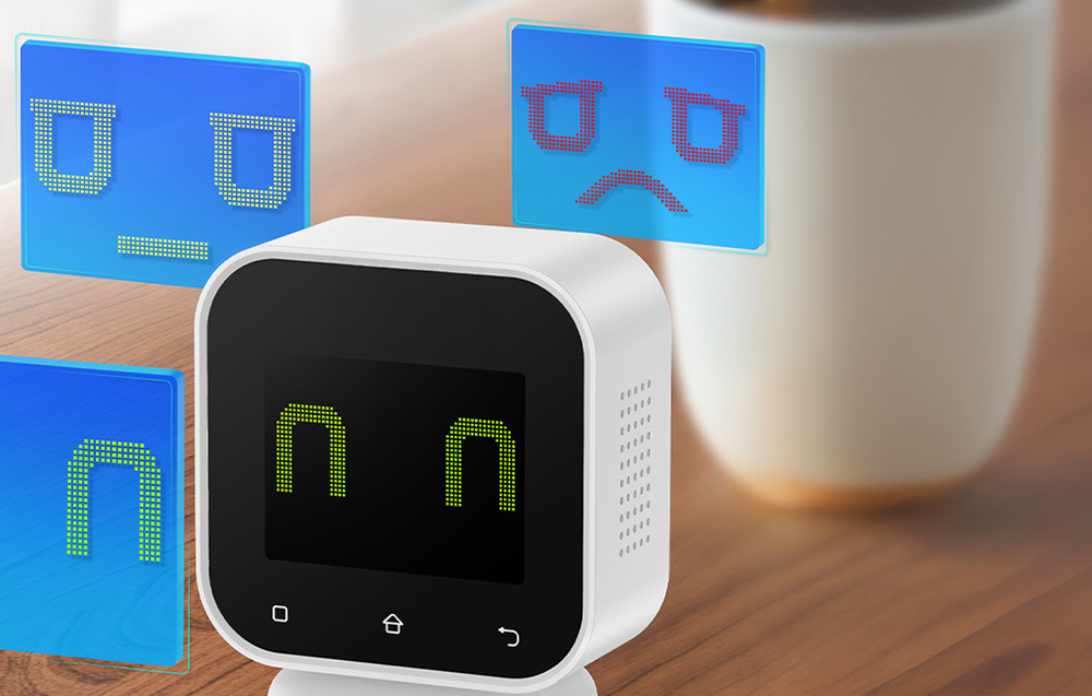 Air quality monitor displaying animated emoticons indicating air quality.