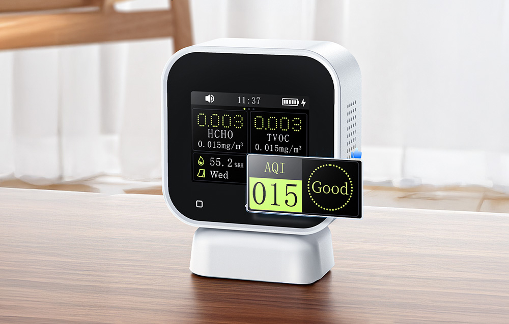 Air quality monitor with a magnified view of the AQI indicator showing a good air quality rating.