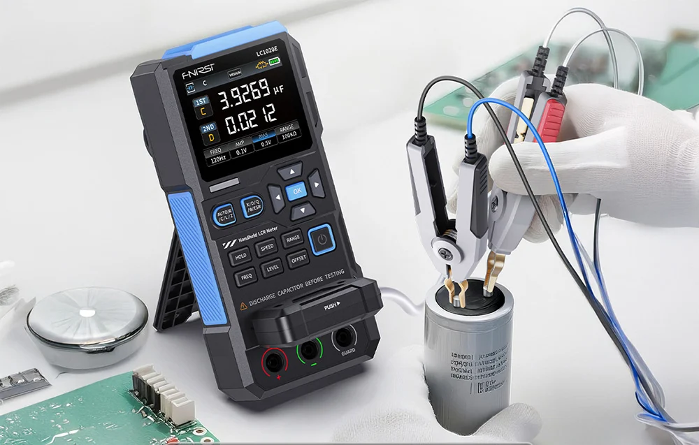 A hand in a white glove uses a handheld meter to test elements