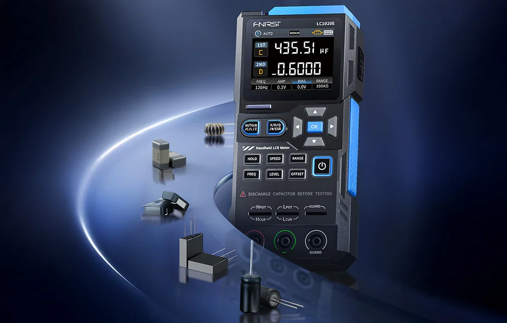 Handheld meter on a dark background, with various components for testing on a transparent track on the left