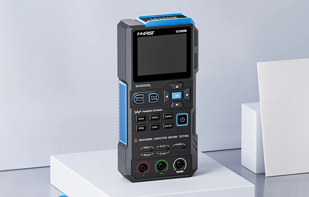 Handheld meter standing on a white box